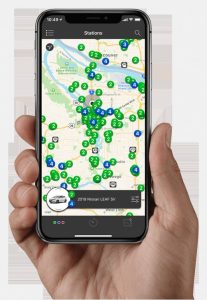 A cellphone with the Chargeway app showing location of vehicle charging stations.