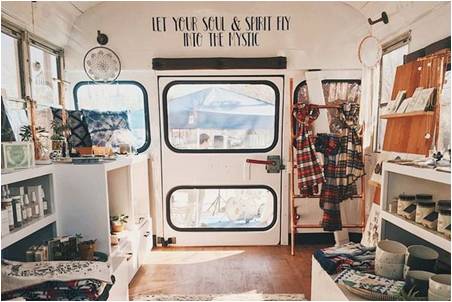 The inside of a truck used as a boutique shop.